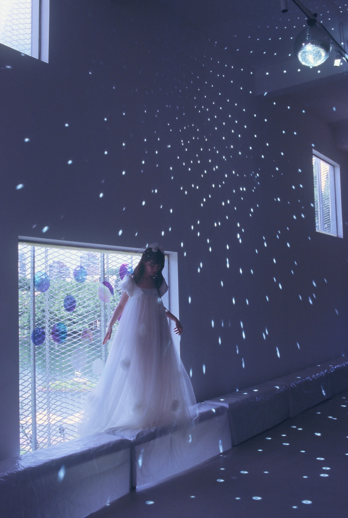 A bride under a constellation of light in the Futur runway film