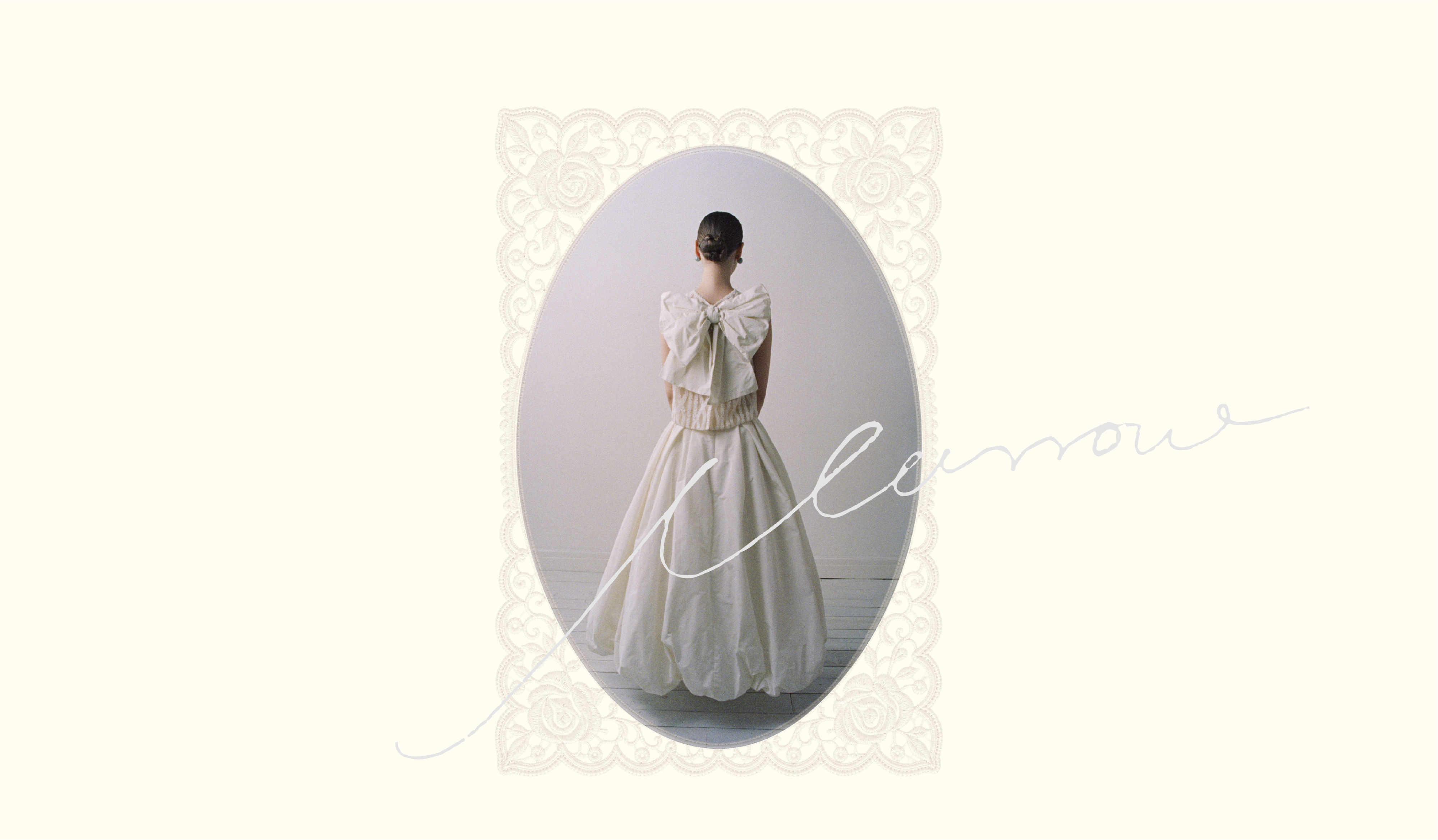 A bride in a lace-framed oval wearing a white Marrow dress